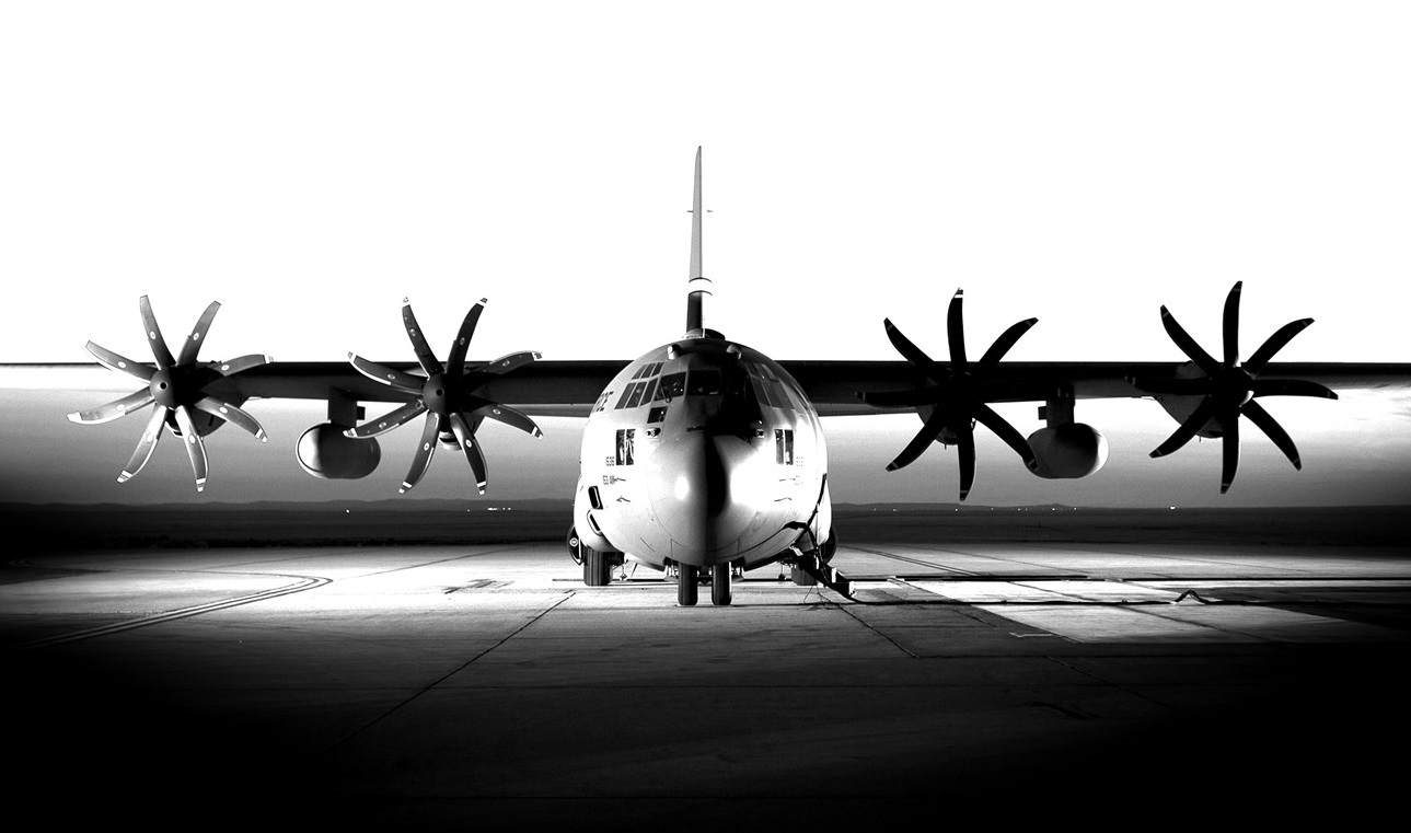black and white military aircraft on tarmac