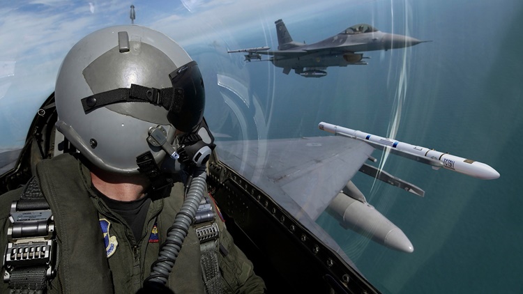 fighter pilot mask and fighter jet flying in formation