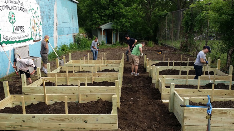 Volunteers in Binghamton, NY working in raised garden beds for a community garden